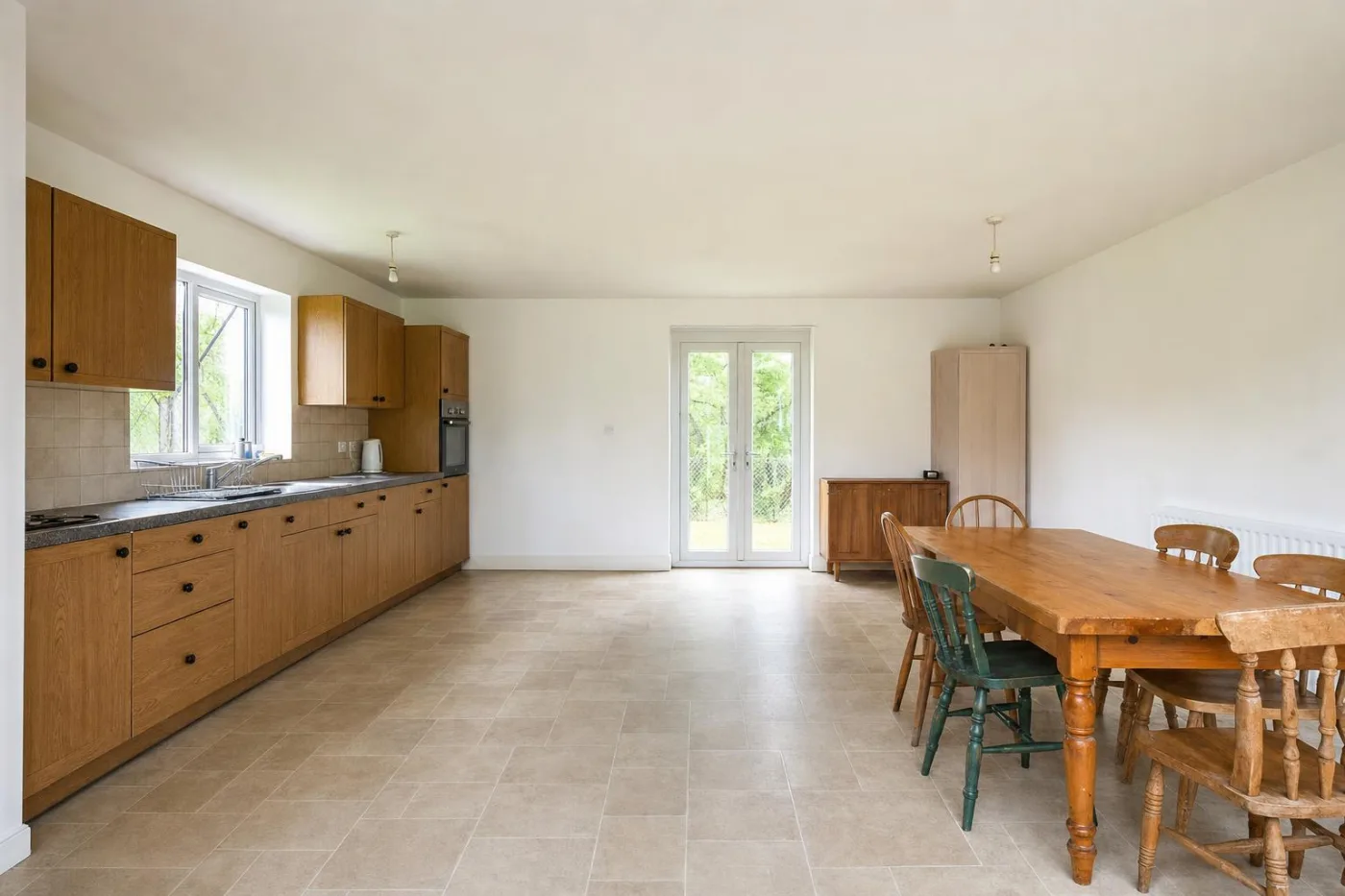 A large open-plan kitchen photographed by the homeowner