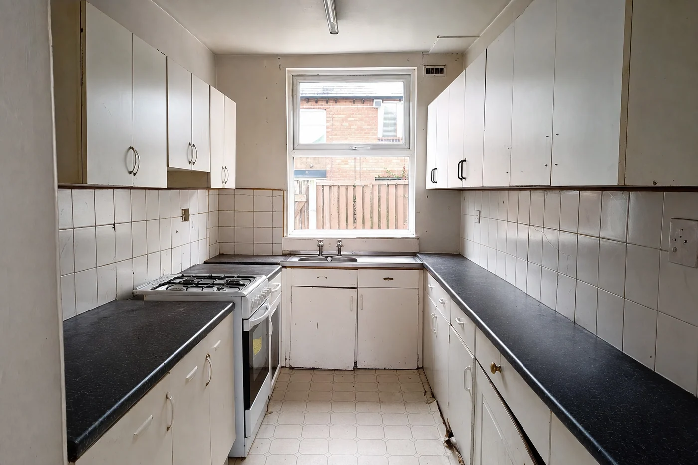 A narrow galley kitchen photographed by the homeowner