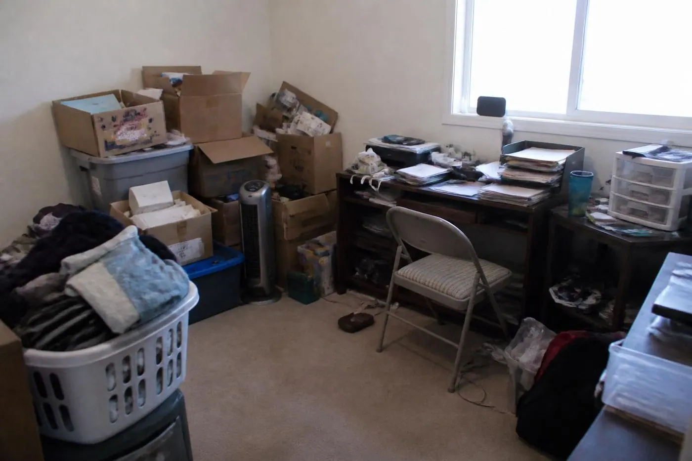 A cluttered room before preparation